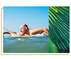 older man surfing happily