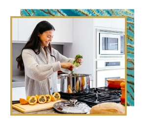 30s woman cooking something healthy in her kitchen